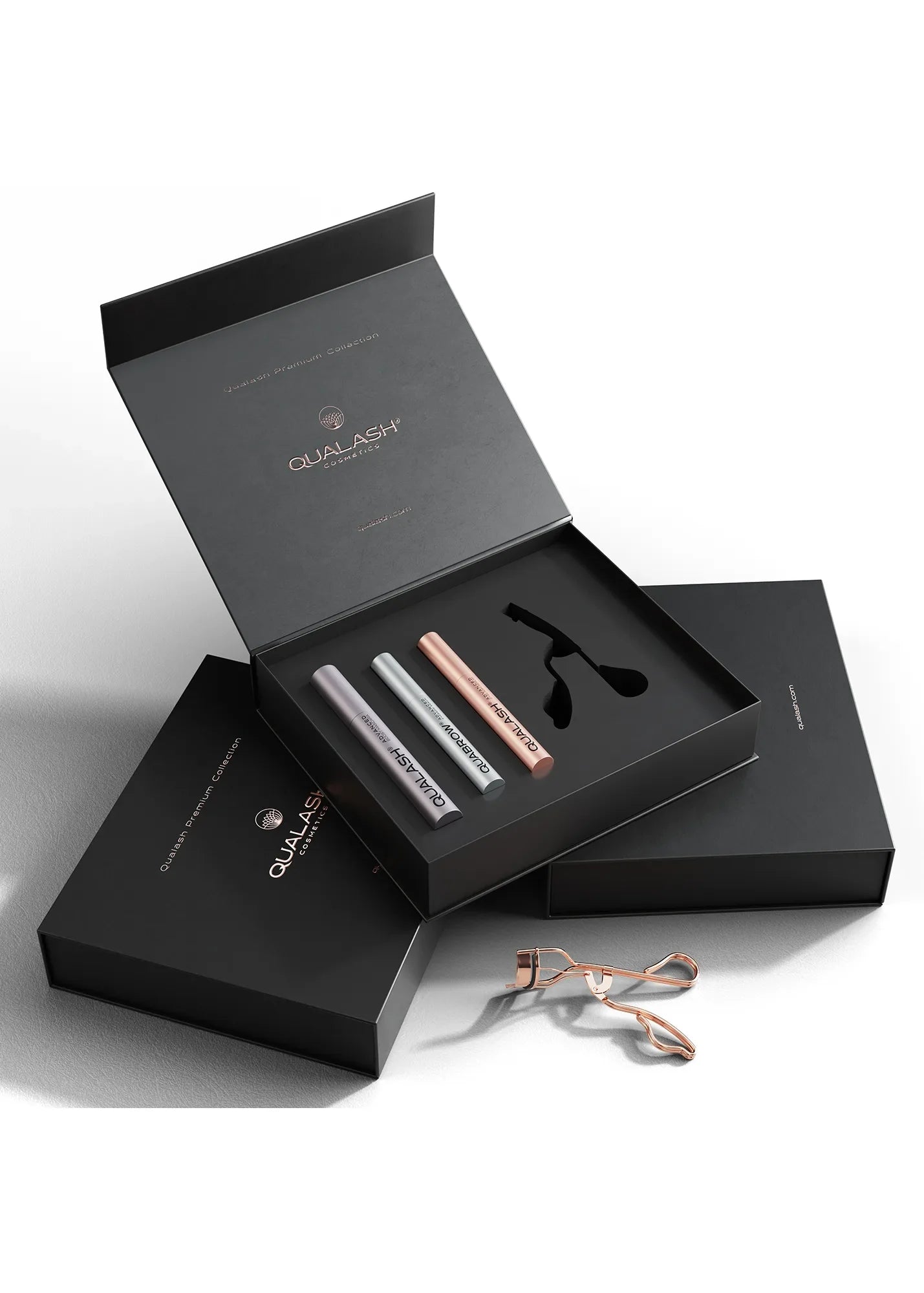 Stylish lifestyle photo of Qualash Premium Collection with curler and product packaging